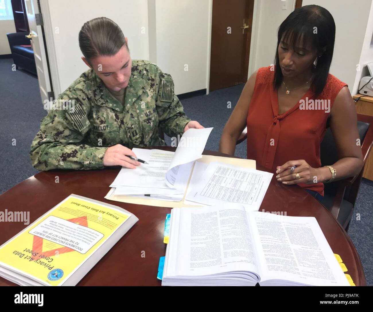 Fla. (July 12, 2018) The Center for Information Warfare Training's (CIWT) legal team, comprised of Lt. Alison Malloy (left) and Tammy Hawkins, is paramount to the daily operations of the successful training of thousands of information warfare professionals each year throughout the CIWT domain.  Both bring a broad range of legal talent, expertise and innovative thinking to help the CIWT domain operate in today’s increasingly complex legal and regulatory environments. Stock Photo