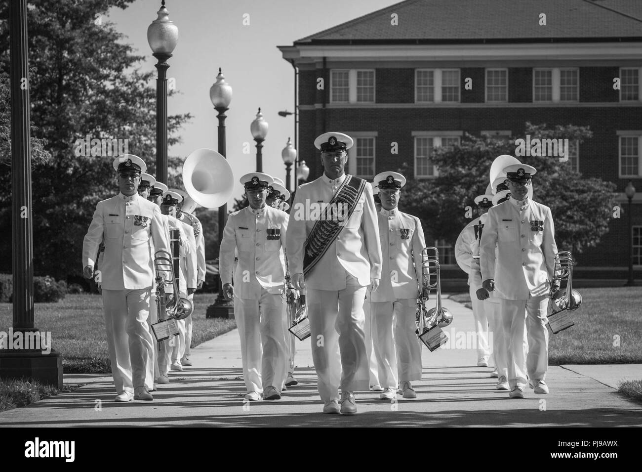 The U.S. Navy Band marches into place during the Joint Base Anacostia-Bolling Parade as the base  celebrates its 100th Anniversary Jul 3, 2018. Bolling Field was officially dedicated on 1 July, 1918, after the property was purchased by the War Department and turned over to the Aviation Section of the Signal Corps to serve as the primary aviation facility for the capital city. This new military property was appropriately named for Colonel Raynal C. Bolling, an early vanguard in the quest for Army airmanship. Stock Photo