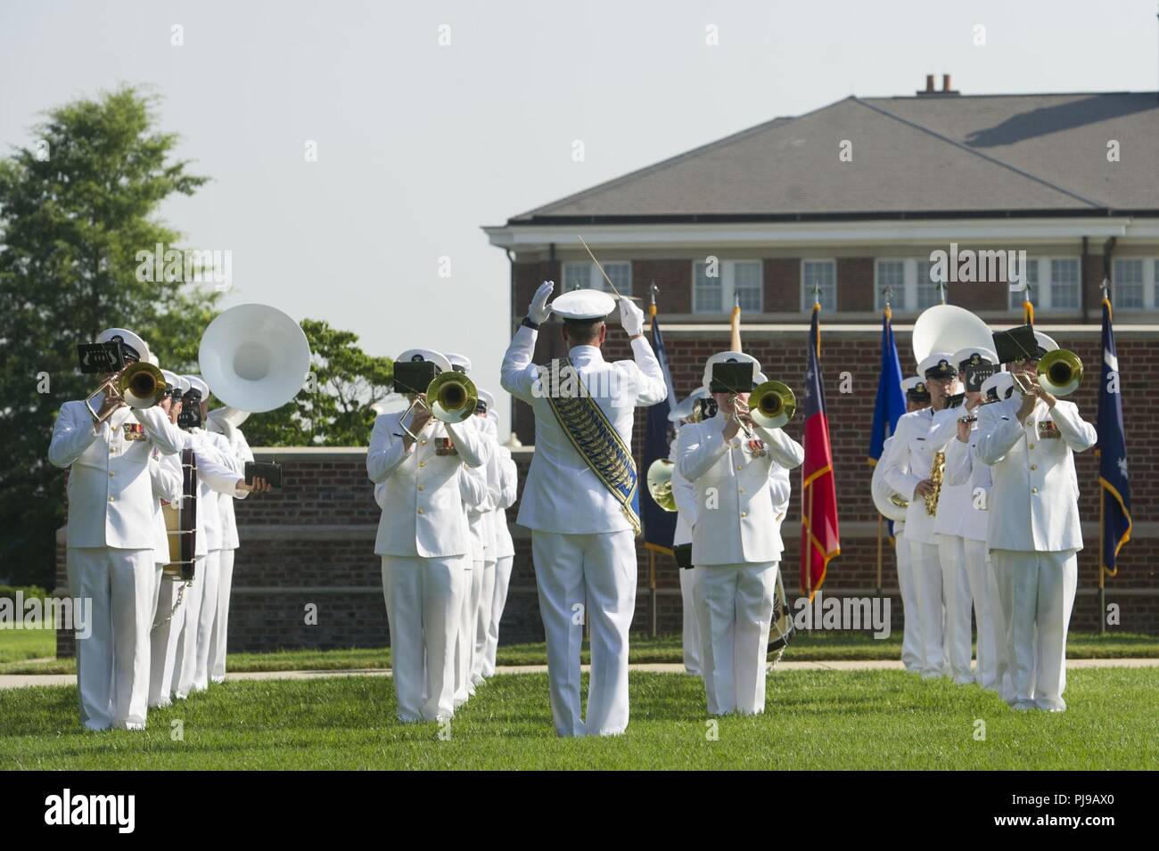 The U.S. Navy Band performs during the Joint Base Anacostia-Bolling Parade as the base celebrates its 100th Anniversary Jul 3, 2018. Bolling Field was officially dedicated on 1 July, 1918, after the property was purchased by the War Department and turned over to the Aviation Section of the Signal Corps to serve as the primary aviation facility for the capital city. This new military property was appropriately named for Colonel Raynal C. Bolling, an early vanguard in the quest for Army airmanship. Stock Photo