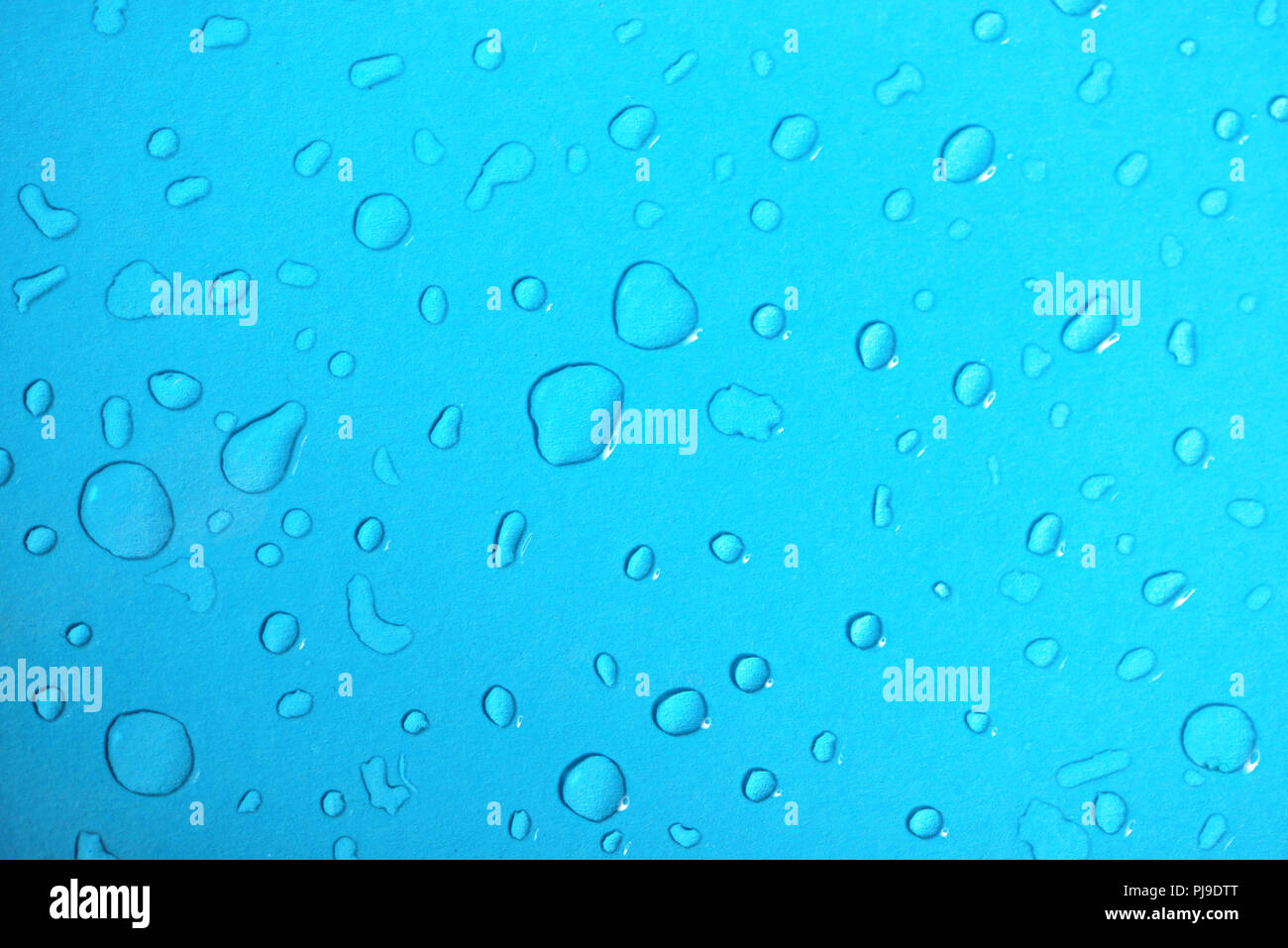 Water drops on a blue glass background Stock Photo - Alamy