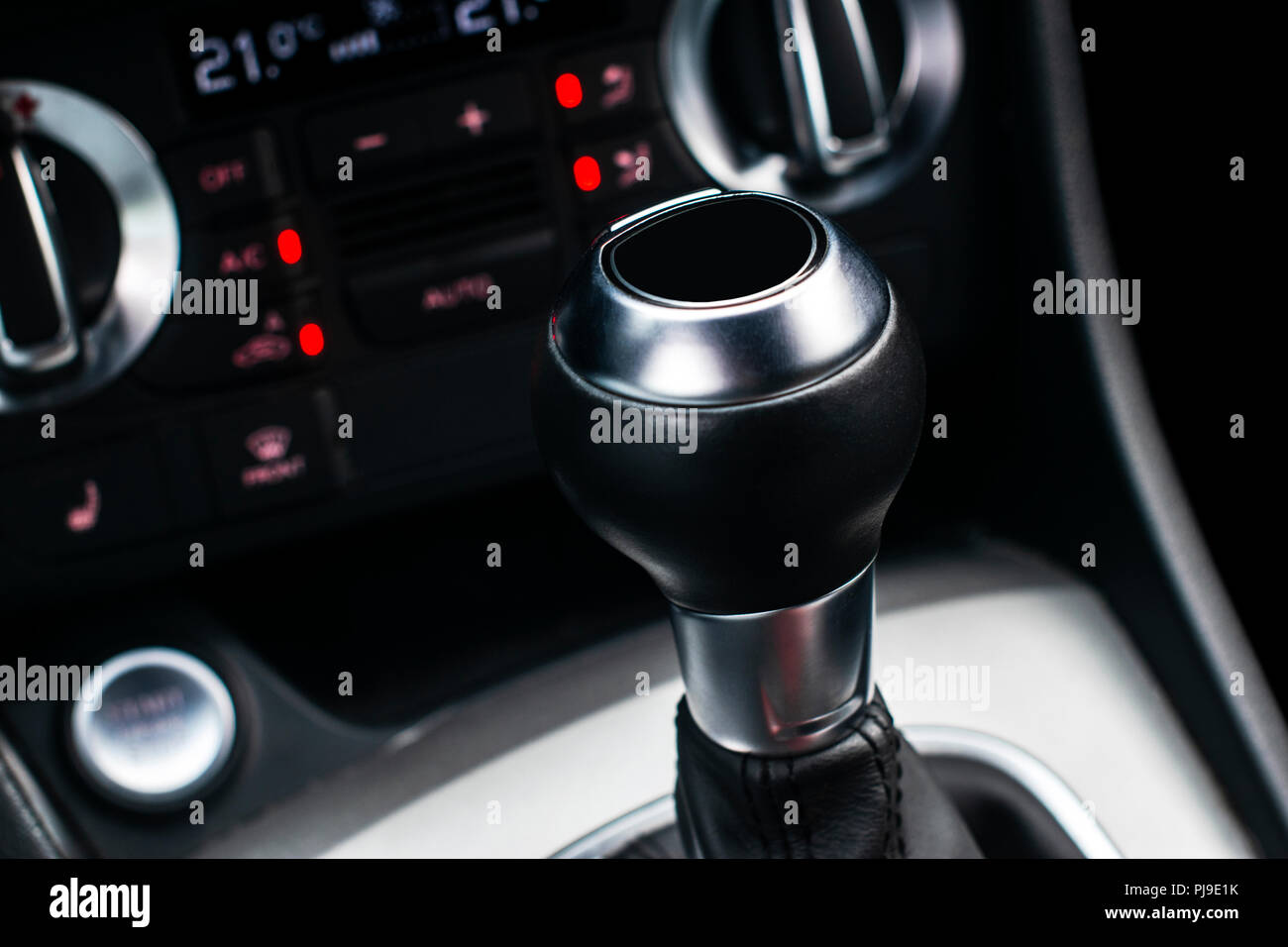 Close up view of a gear lever shift. Manual gearbox. Car interior details. Car transmission. Soft lighting. Abstract view. Car detailing Stock Photo