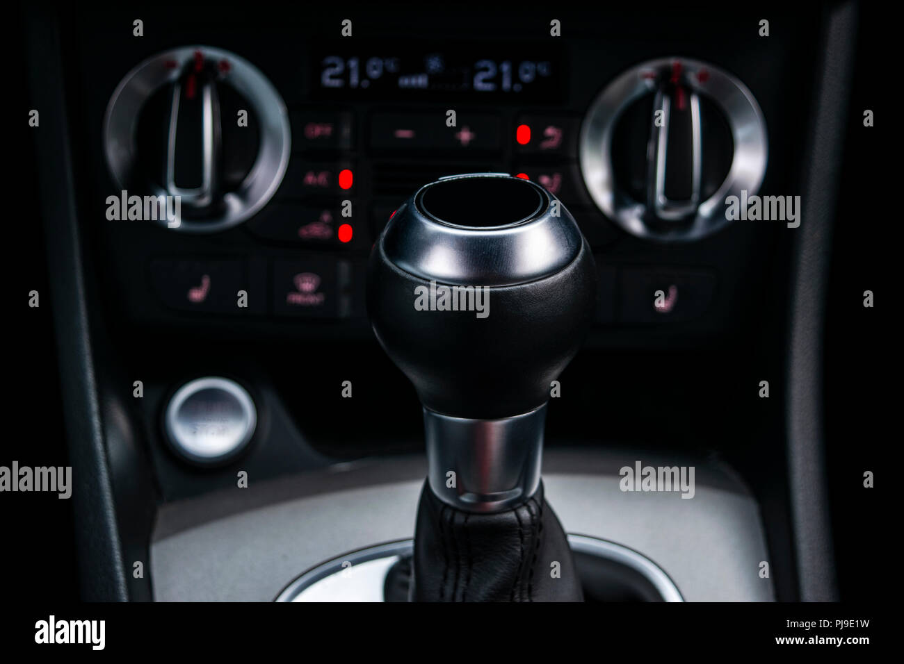 Close up view of a gear lever shift. Manual gearbox. Car interior details. Car transmission. Soft lighting. Abstract view. Car detailing Stock Photo