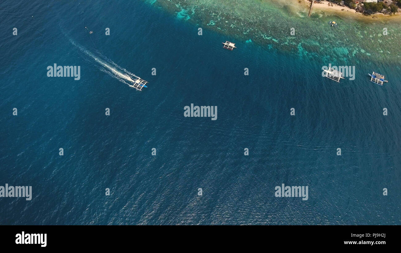 Aerial view of motor boat in sea, moalboal. Aerial image of motorboat ...
