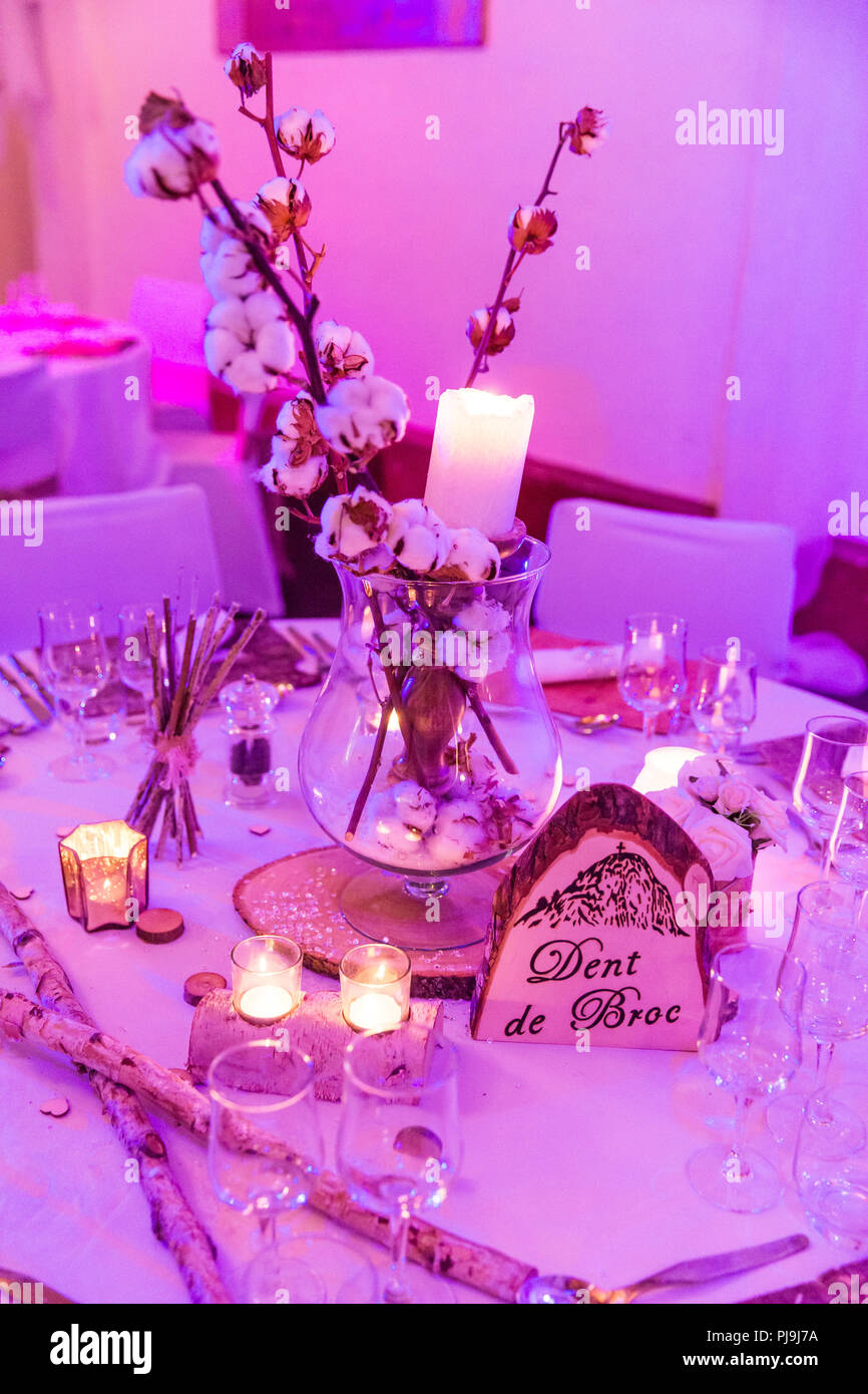 Wood Wedding Table Decoration in Candle and Purple Lighting Stock Photo