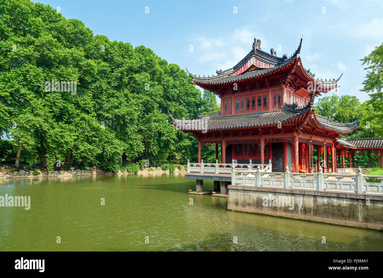 Chinese traditional classical architecture by the lake Stock Photo - Alamy