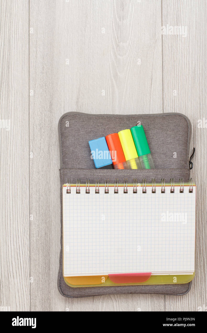 School supplies. Open exercise book on bag-pencil case with color felt ...