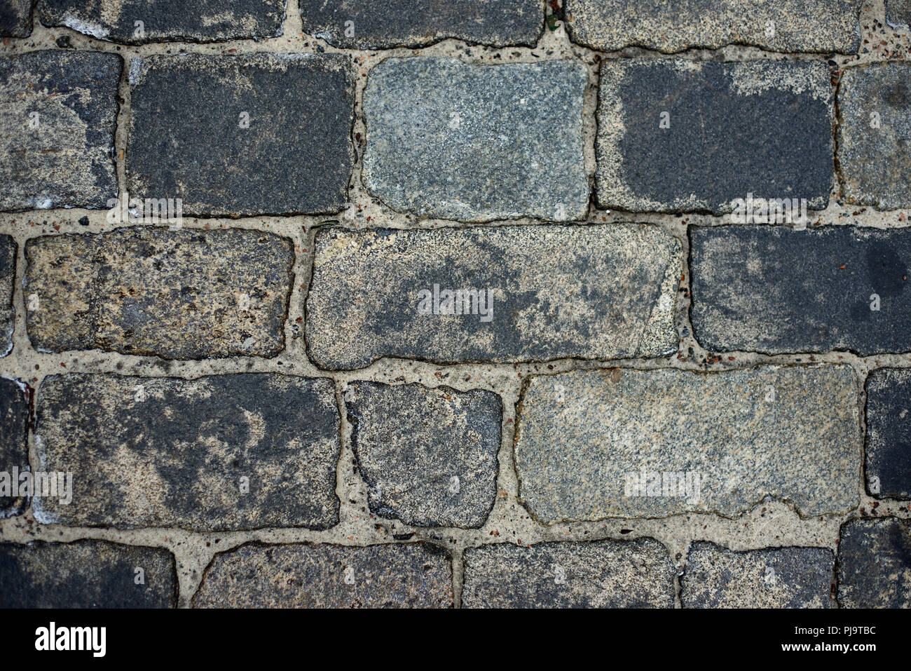 old cobblestone road for background or texture Stock Photo - Alamy