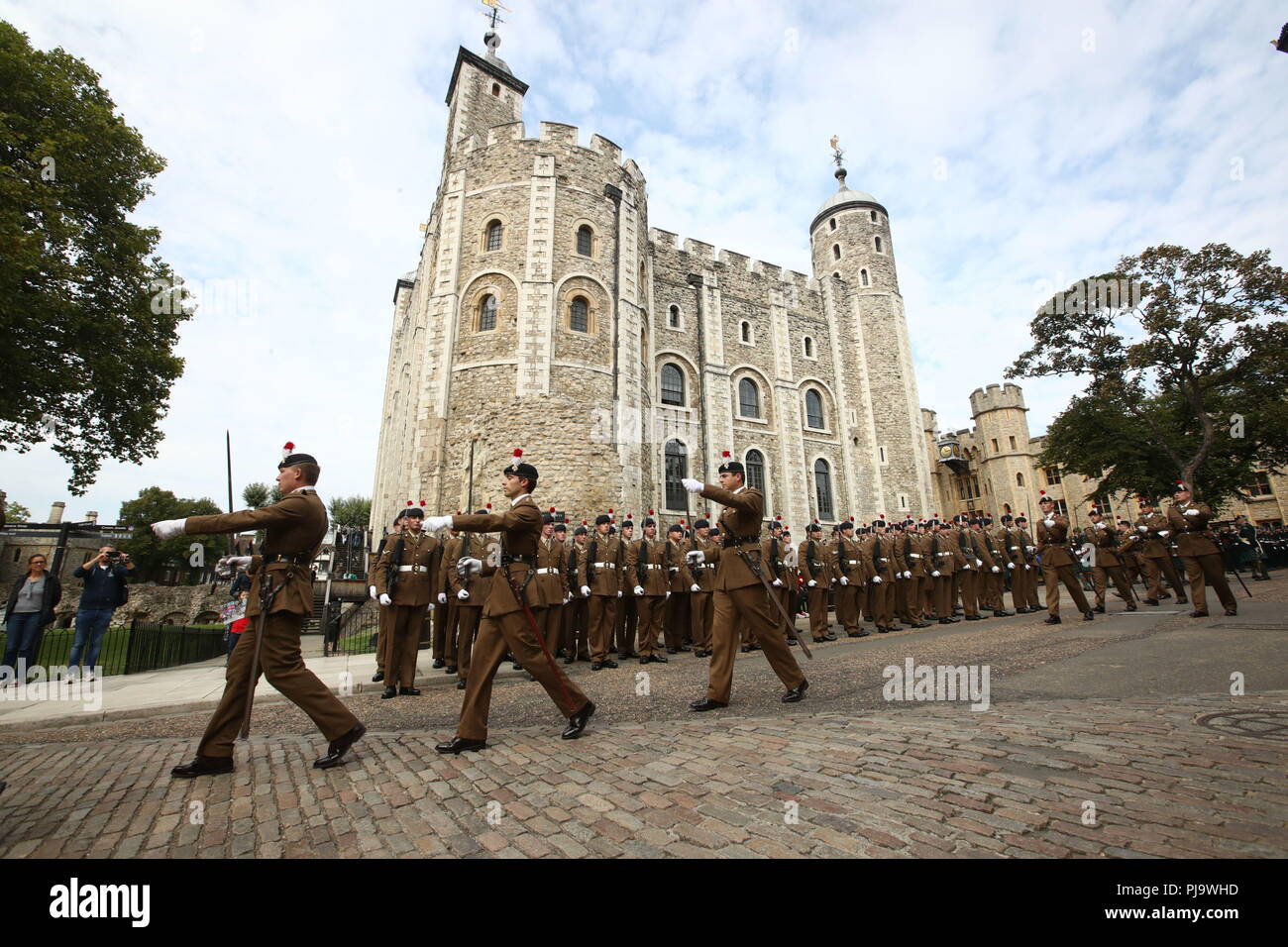 Members of the Royal Regiment of Fusiliers wait to set of from the Tower of London on a parade through the city of London to celebrate 50 years since their regiment was formed. Stock Photo