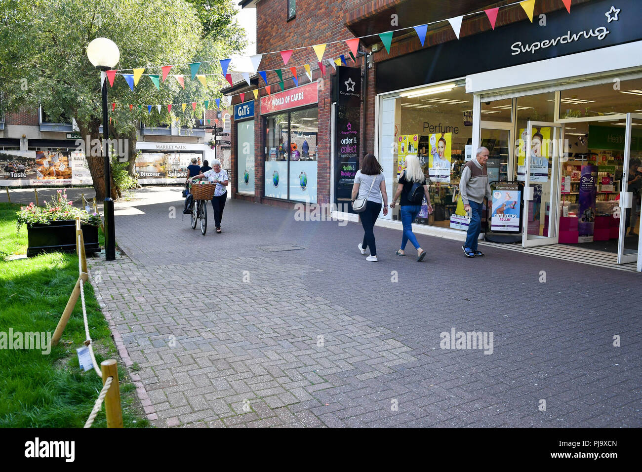 Shoppers Walk Past Businesses At The Spot Where The Bench Was