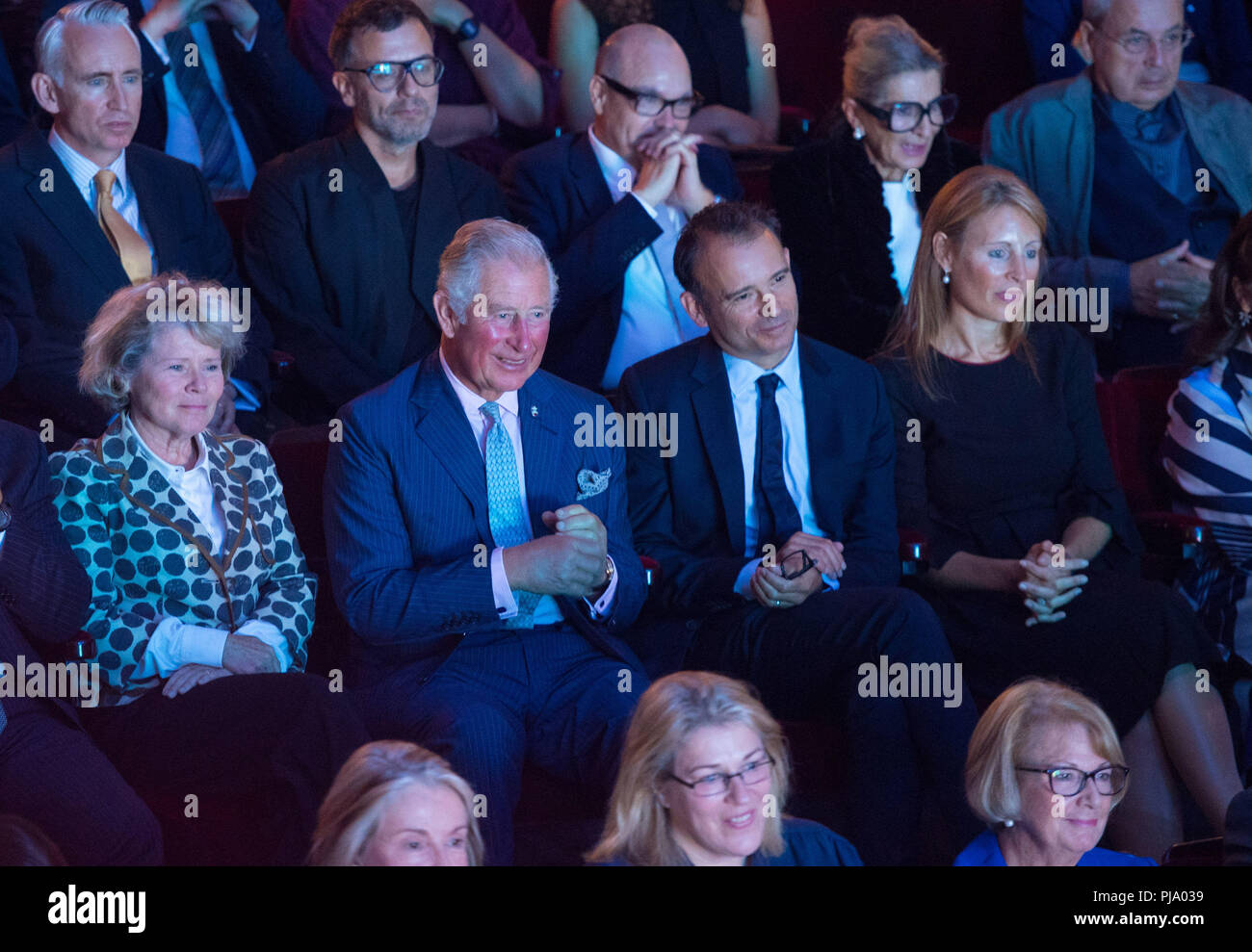 The Prince of Wales watches a performance alongside (left to right) actress Imelda Staunton, Old Vic Artistic Director Matthew Warchus and Old Vic Executive Director Kate Varah at the Old Vic Theatre, in central London, during a visit to mark the theatre's 200th anniversary. Stock Photo