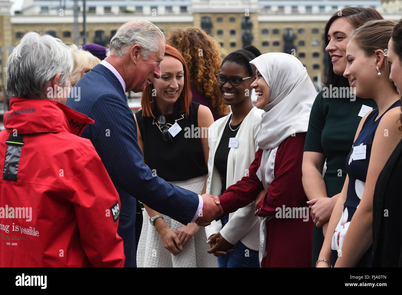 The Prince of Wales meets representatives and beneficiaries of the Maiden Factor charity during a visit at HMS President in London, to see the yacht 'Maiden' used by the first all-female crew and skippered by Tracy Edwards, to sail in the Whitbread Round the World Race, in which they finished second in 1990. Stock Photo