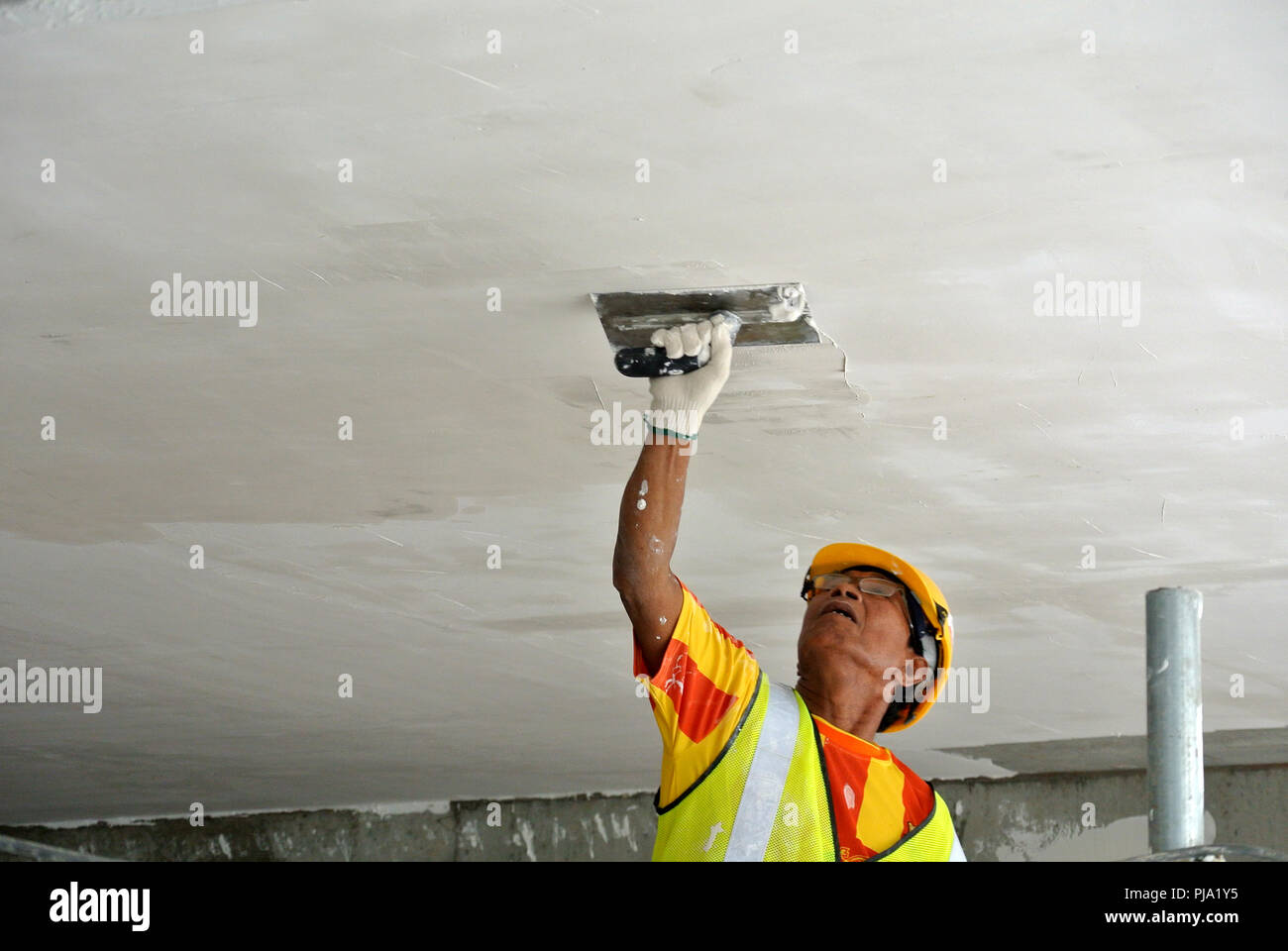 Construction Site Workers Are Doing Ceiling Soffit Skim Coat
