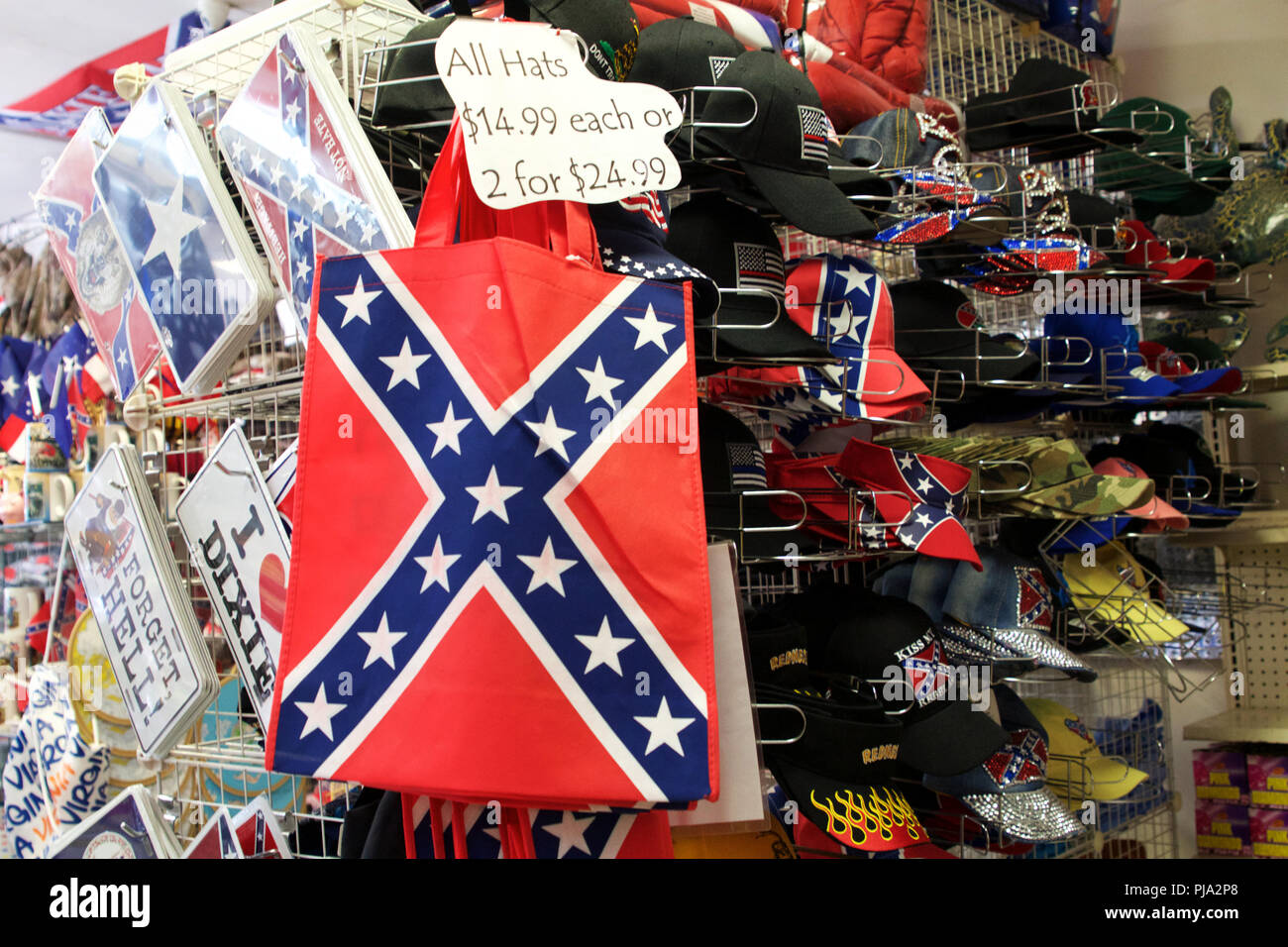 New Church, Virginia, USA - September 1, 2018: Confederate flags surpass American flags in size and number at Dixieland, a gas station and gift shop. Stock Photo