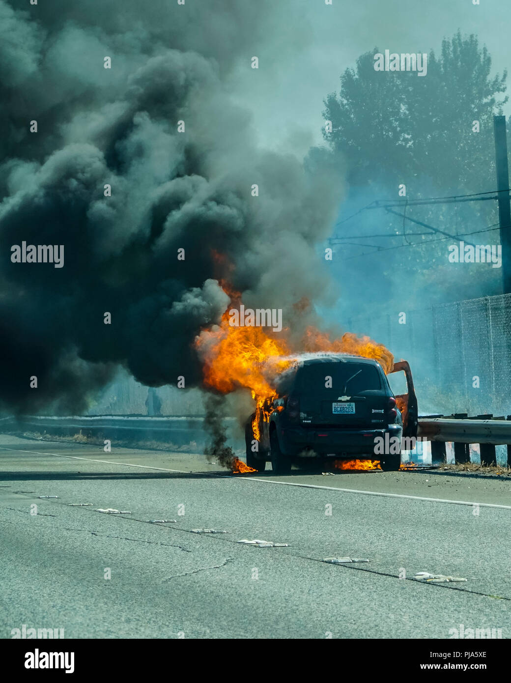 A Chevy HSR on fire on Interstate 5 in Seattle Washington USA Stock Photo