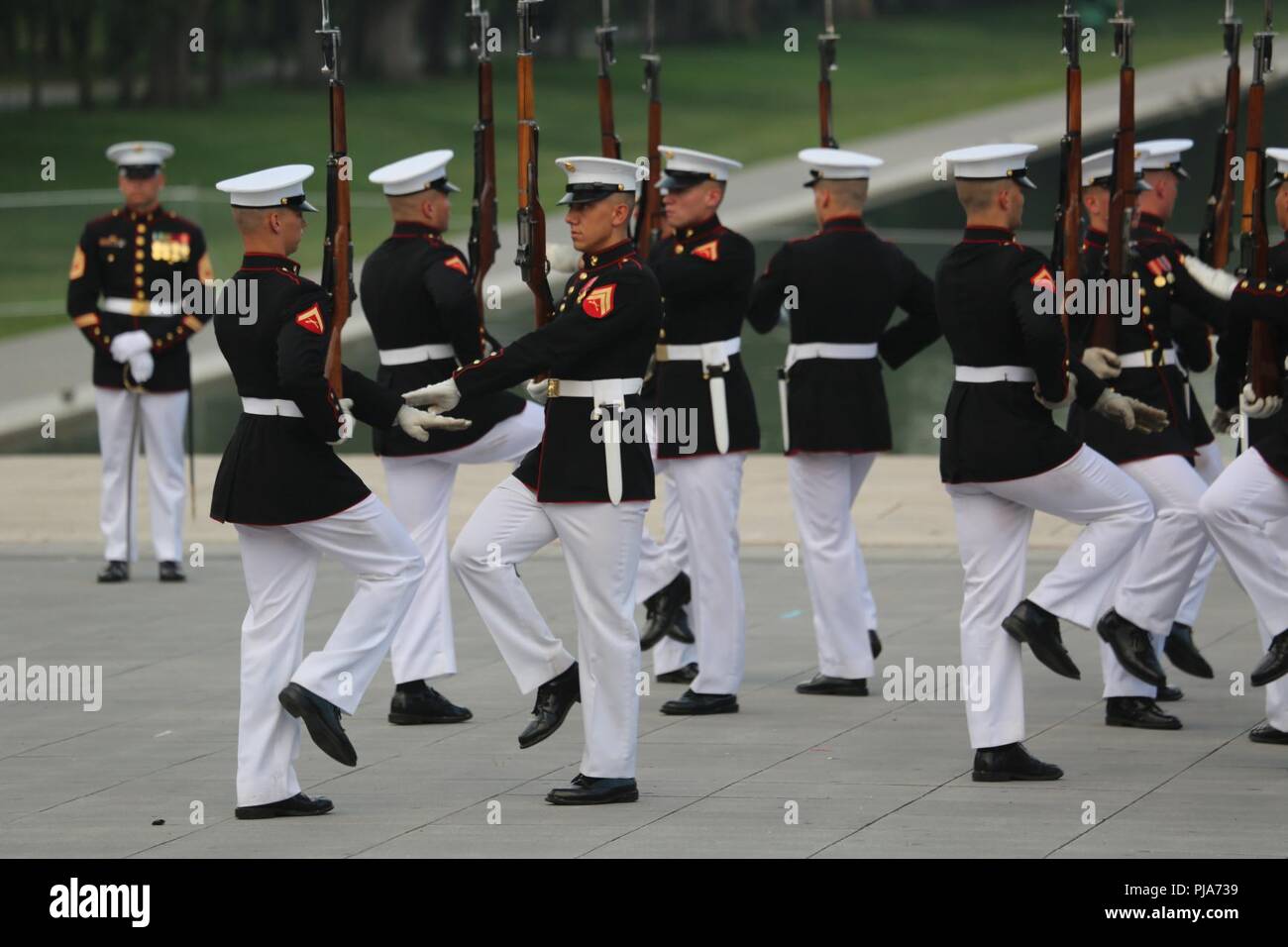 Marines with the U.S. Marine Corps Silent Drill Platoon execute precision rifle drill movements