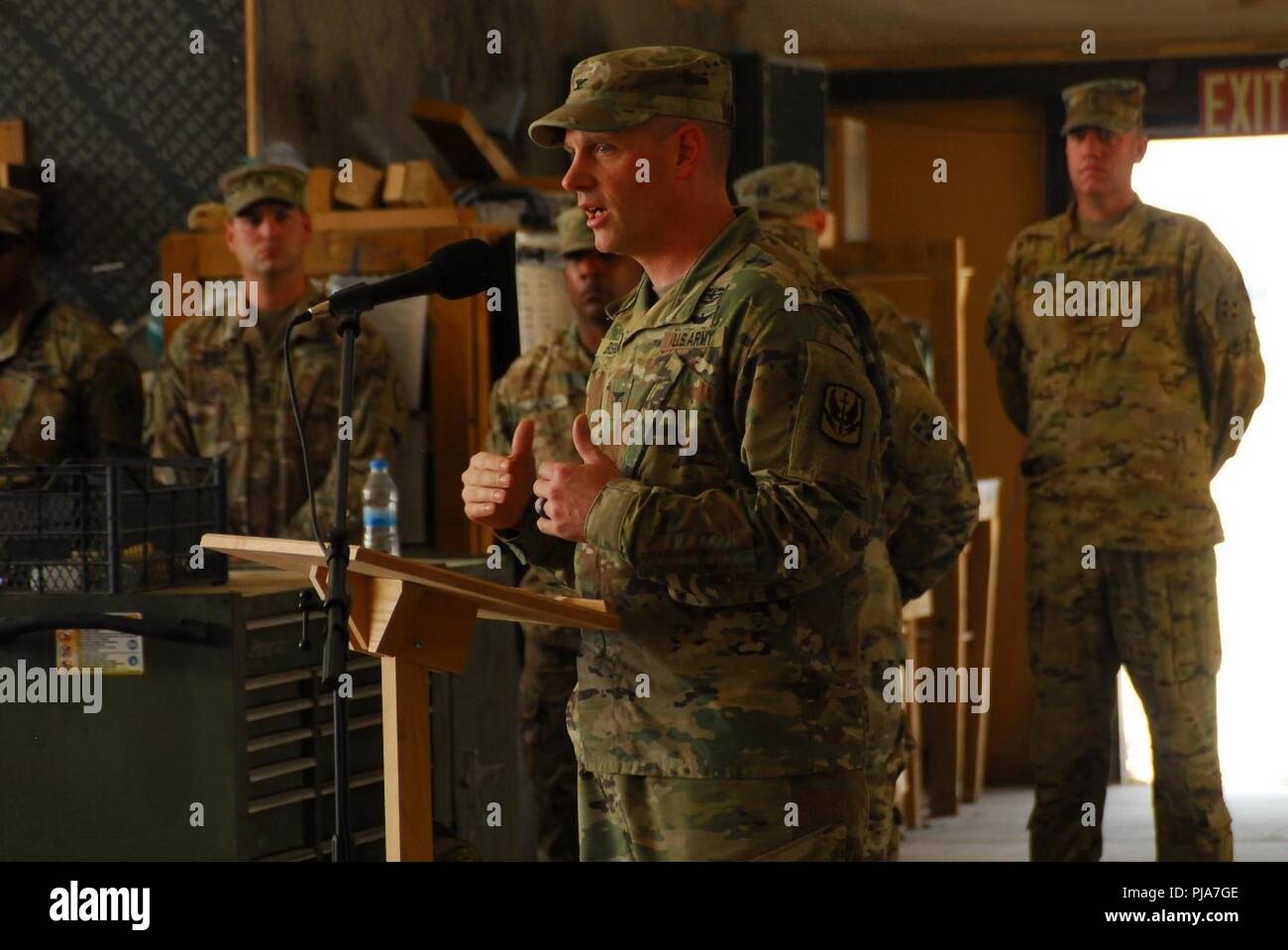 ERBIL, Iraq - U.S. Army 449th Combat Aviation Brigade Commander Col. Joseph Bishop, gives the Soldiers of the 4th Attack Reconnaissance Battalion, 4th Aviation Regiment a gracious welcome as they replace the 7th Squadron, 17th Cavalry during a transfer of authority ceremony July 2, 2018.  The transfer of authority ceremony signified the assumption of command of the mission to provide enabling support to Coalition and partner forces in the defeat-ISIS mission in support of Operation Inherent Resolve. Stock Photo