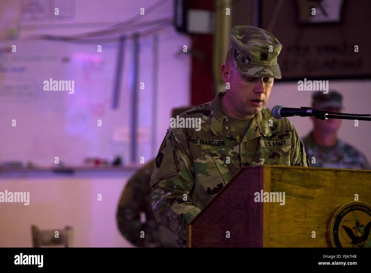 U.S. Army Lt. Col. Sean Ibarguen, commander, 1st Battalion 141st Infantry Regiment, known as “Task Force Alamo,” speaks during the transfer of authority ceremony on Camp Lemonnier, July 5, 2018. Task Force Alamo is taking over authority and command from Task Force Bayonet. Stock Photo