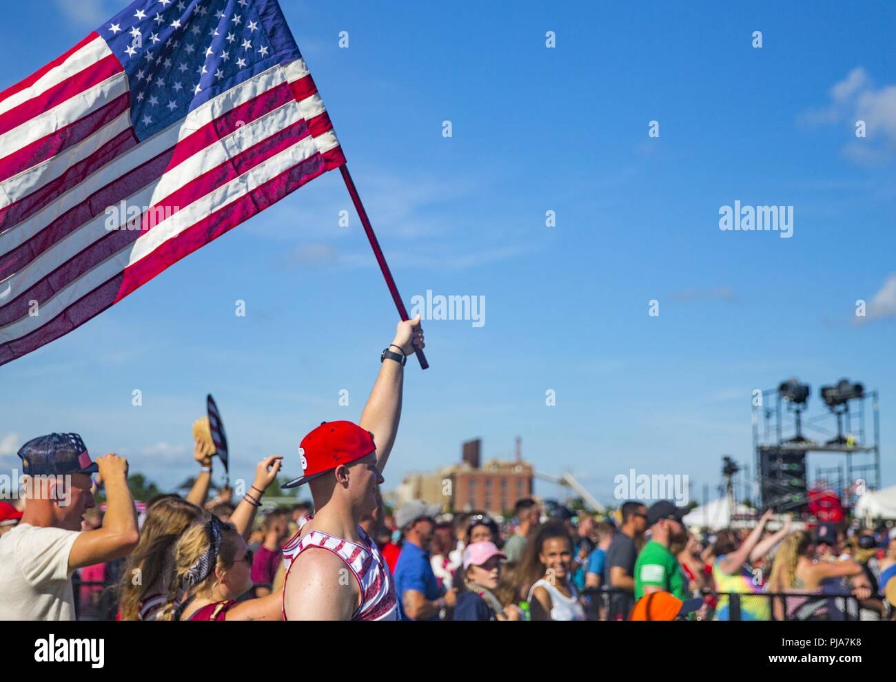 Marines, Sailors, and civilians attend Marine Corps Base Camp Lejeune’s annual fourth of July celebration at William Pendleton Thomas Field on MCB Camp Lejeune, N.C., July 4, 2018. From 1776 to present day, July fourth has been adopted as the birth of American Independence, later on becoming a national holiday in 1870 by Congress. This year also marks the 77th anniversary of Camp Lejeune. Stock Photo