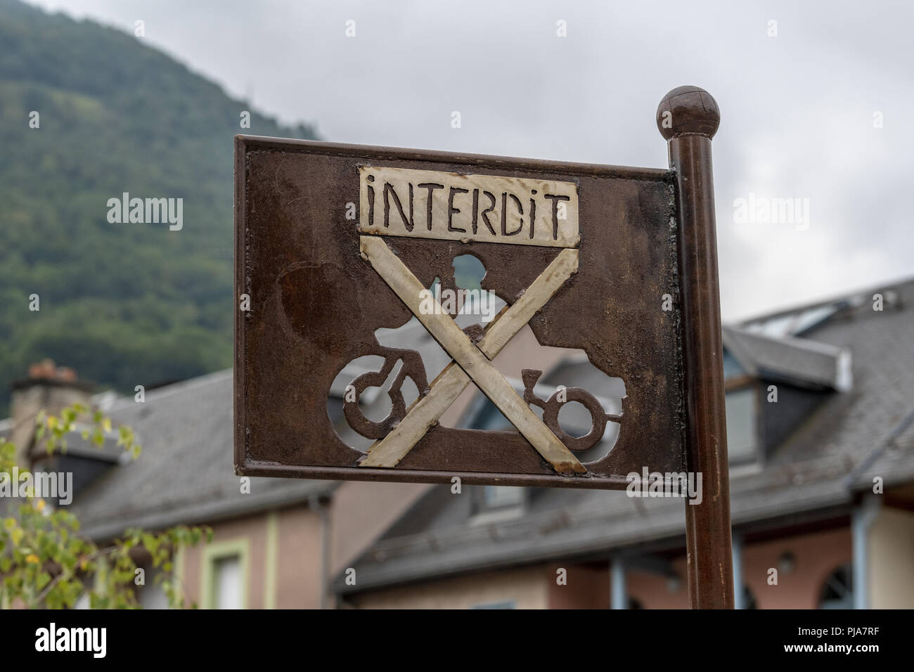 French Village road signs for motorbikes. LUZ-SAINT SAUVER - Les Pyrénées. Rusted effect, Punched out, old sign .       Interdit, Forbidden, allowed, Stock Photo