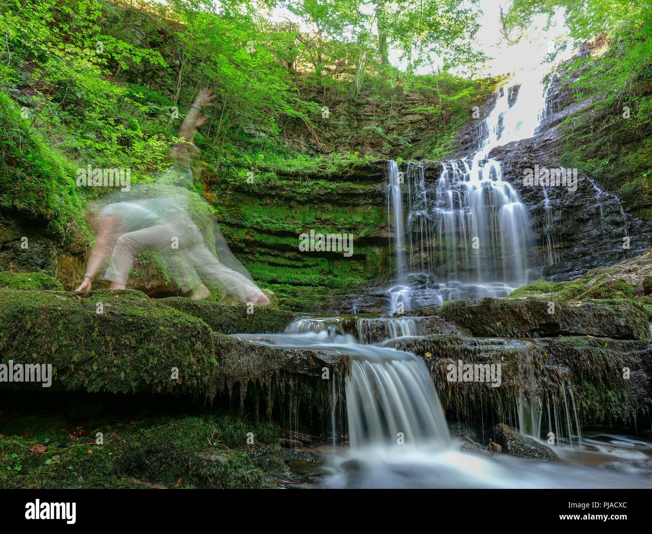 Settle, UK. 5th September 2018. UK Weather woman practicing yoga on a unusually hot sunny September day at Scaleber Force Waterfall, High Hill lane, Settle, Yorkshire Credit: Doug Blane/Alamy Live News Stock Photo