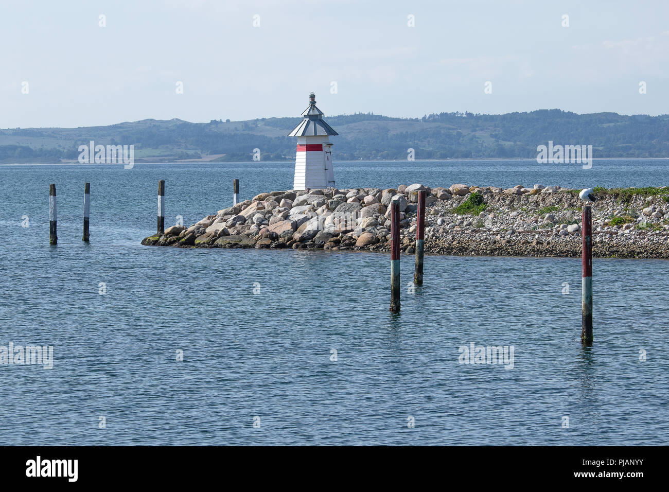 Hvornår sol Bourgogne White wooden lighthouse at the entrance to the port in Ebeltoft Denmark,  with a view to the beautiful Danish nature as backdrop Stock Photo - Alamy