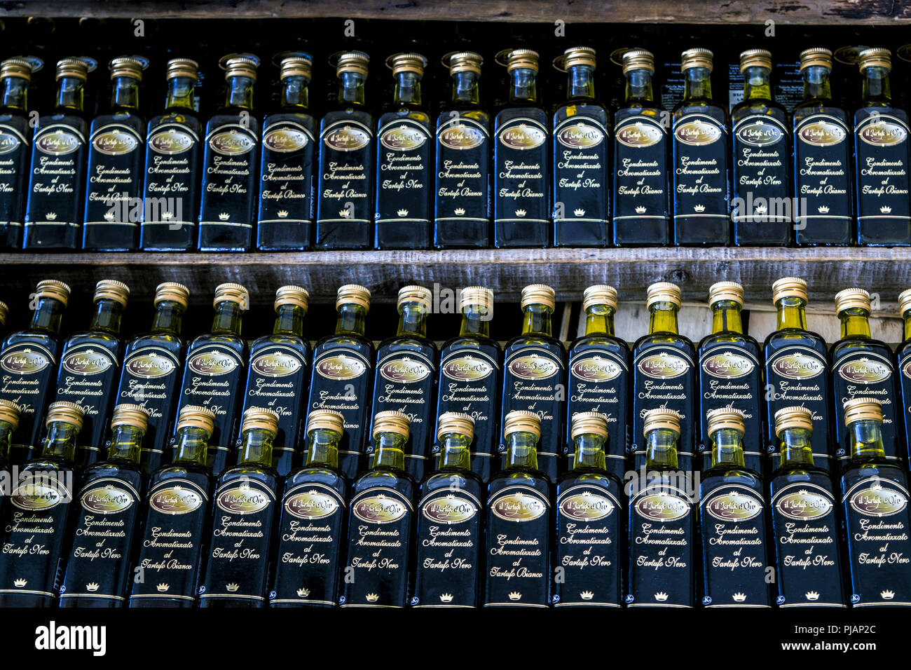 Small olive oil bottles in row Stock Photo Alamy