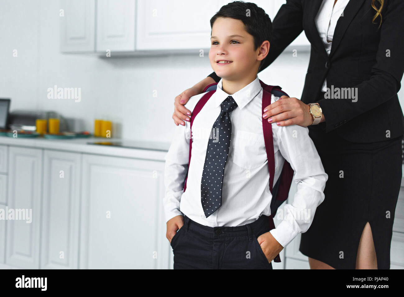 Child school uniform adult home hi-res stock photography and images - Alamy