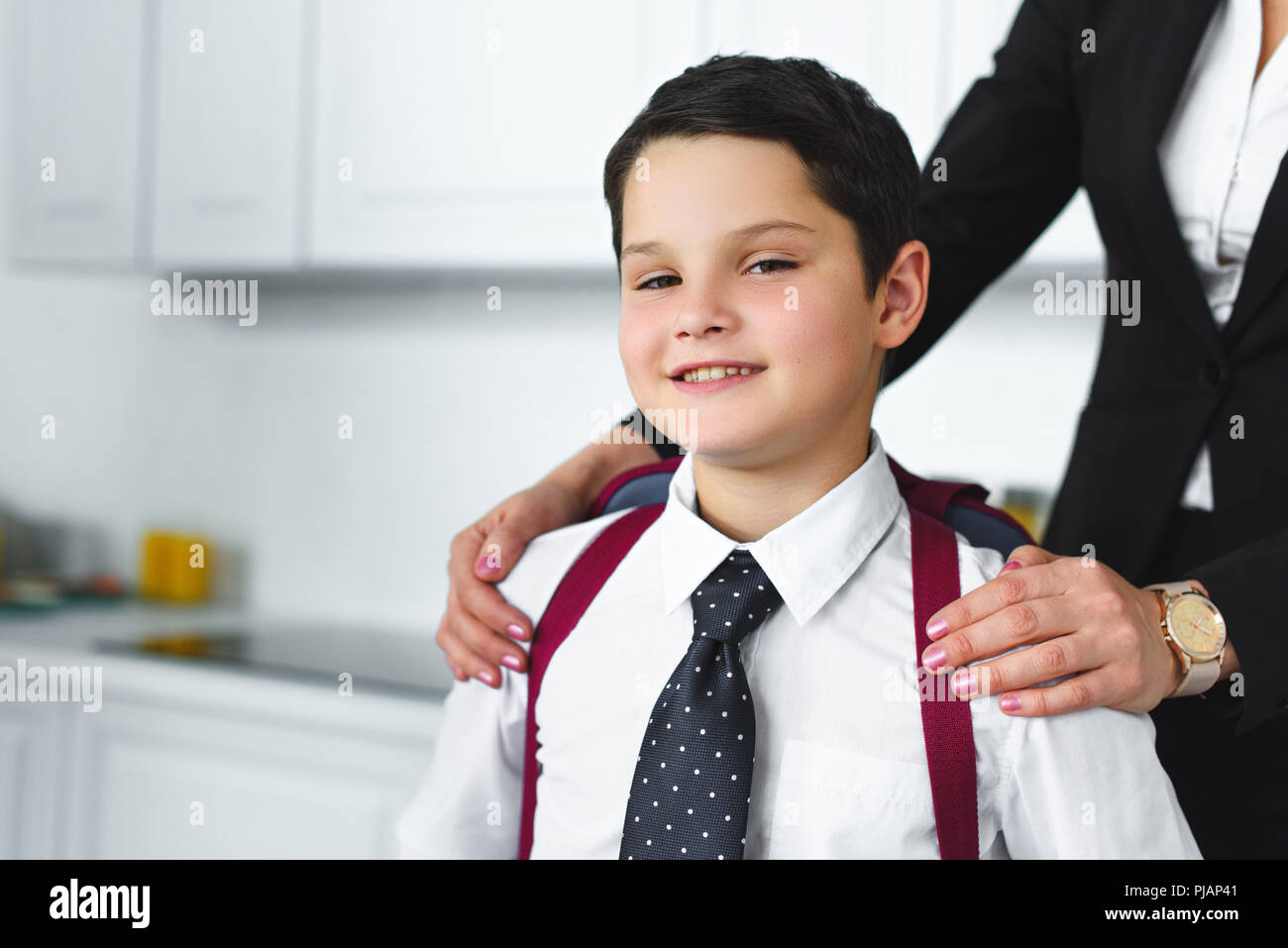Child school uniform adult home hi-res stock photography and images - Alamy