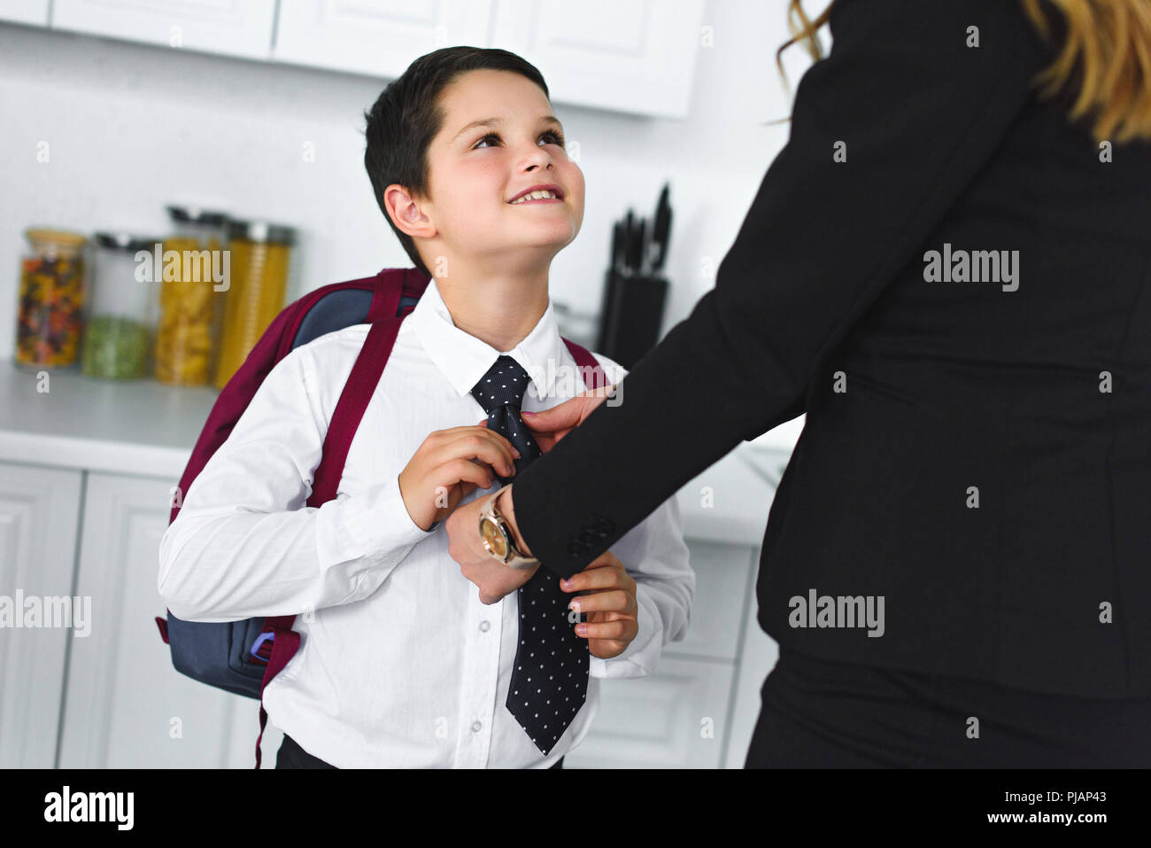 Child school uniform adult home hi-res stock photography and images - Alamy