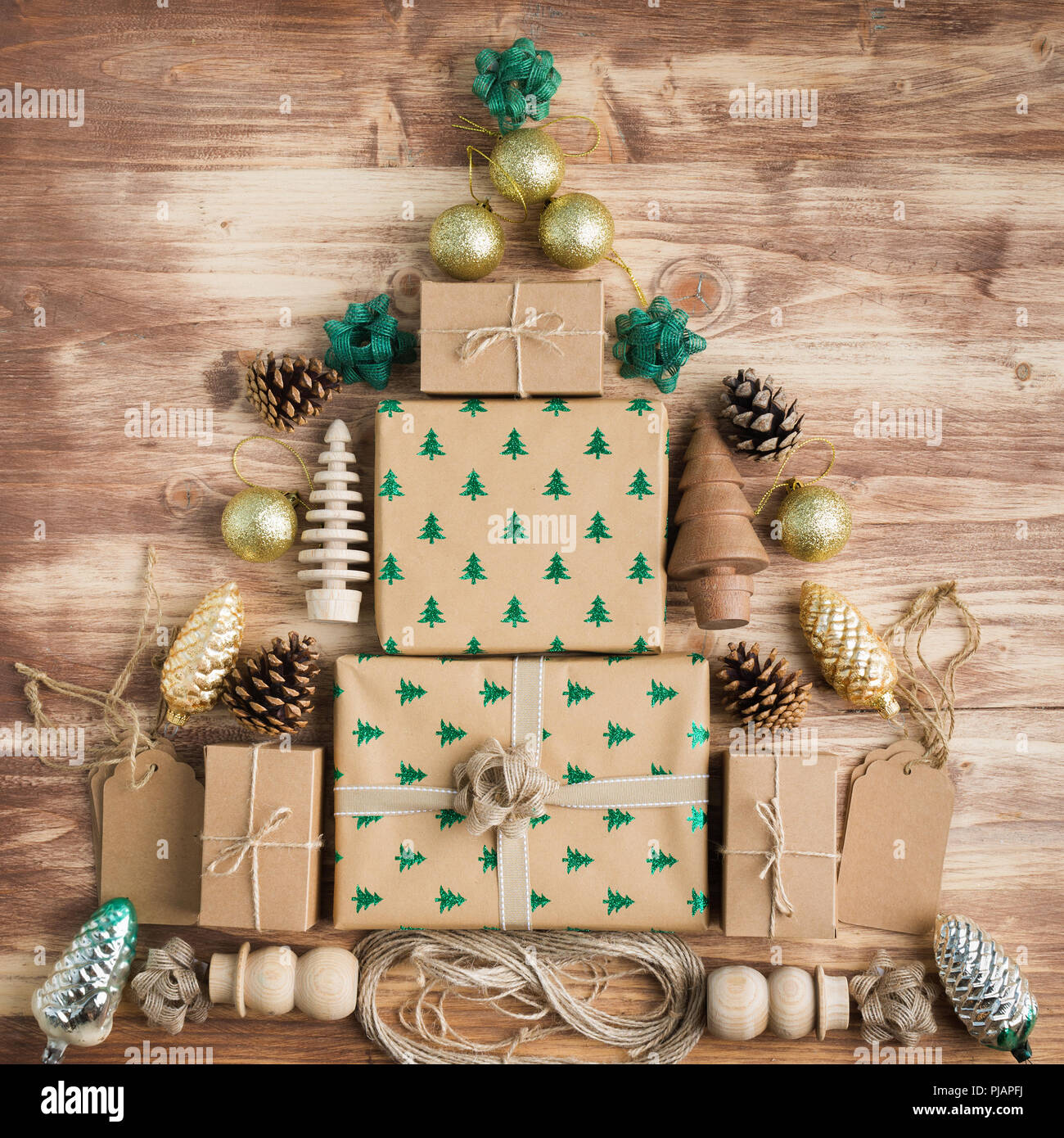 Top View Of Brown Christmas Present Boxes In Arrangement With Sparkling Embossed Fur Trees Pine Cones Golden Baubles Wooden Decorations Jute Twin Stock Photo Alamy
