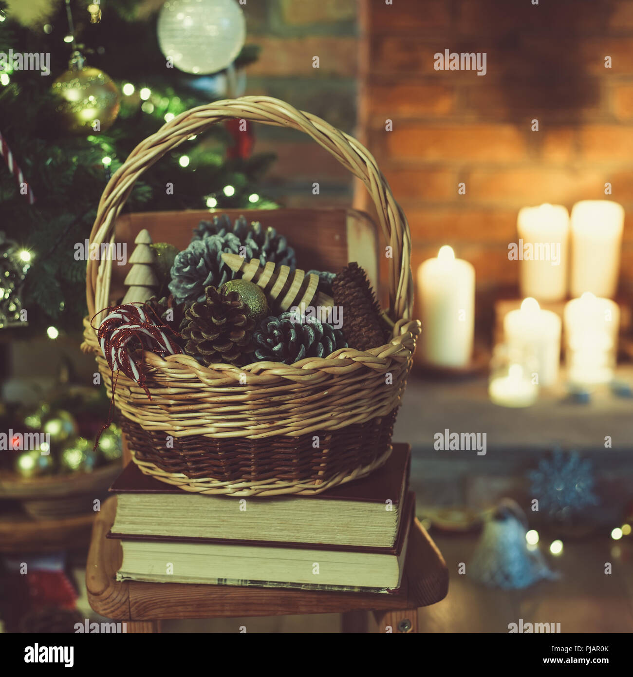 Christmas Decorations In The Basket In Front Of Fireplace With