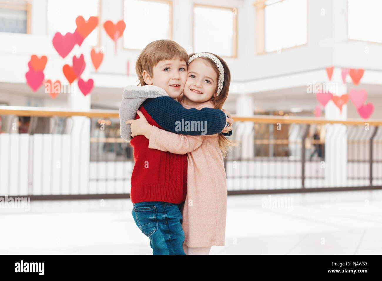 Group Portrait Of Two White Caucasian Cute Adorable Funny Children Boy And Girl Hugging Kissing Each Other Love Friendship Fun Concept Best Friends Stock Photo Alamy