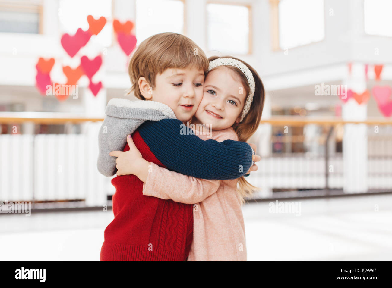 Group Portrait Of Two White Caucasian Cute Adorable Funny Children Boy And Girl Hugging Kissing Each Other Love Friendship Fun Concept Best Friends Stock Photo Alamy
