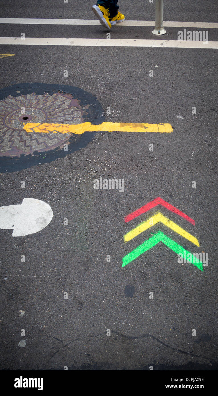 Red, yellow and green arrows painted on pavement Stock Photo Alamy