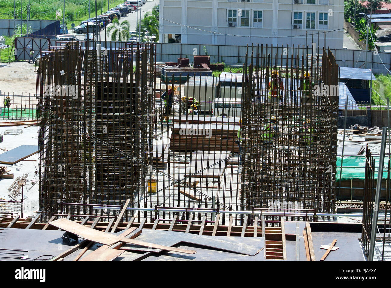 Construction workers installing reinforcement bar at the construction site. Reinforcement bar is