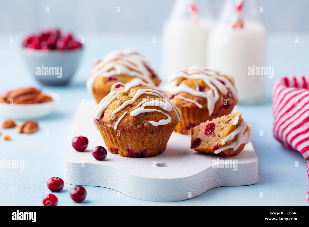 Muffins, cakes with cranberry and pecan nuts. Christmas decoration. Close up. Stock Photo