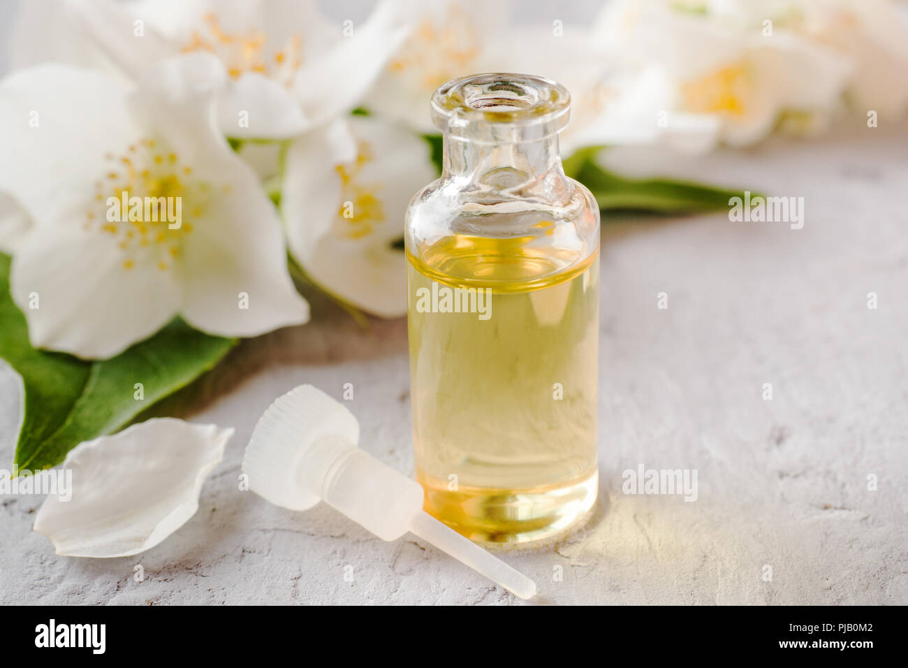 Jasmine oil. Aromatherapy with Jasmine oil and soap. Jasmine flower