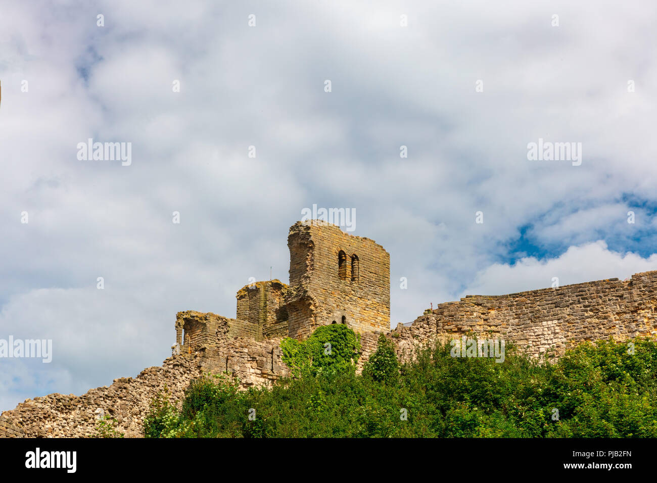 Dramatic cliff side landscape with Scarborough Castle in North Yorkshire. Stock Photo