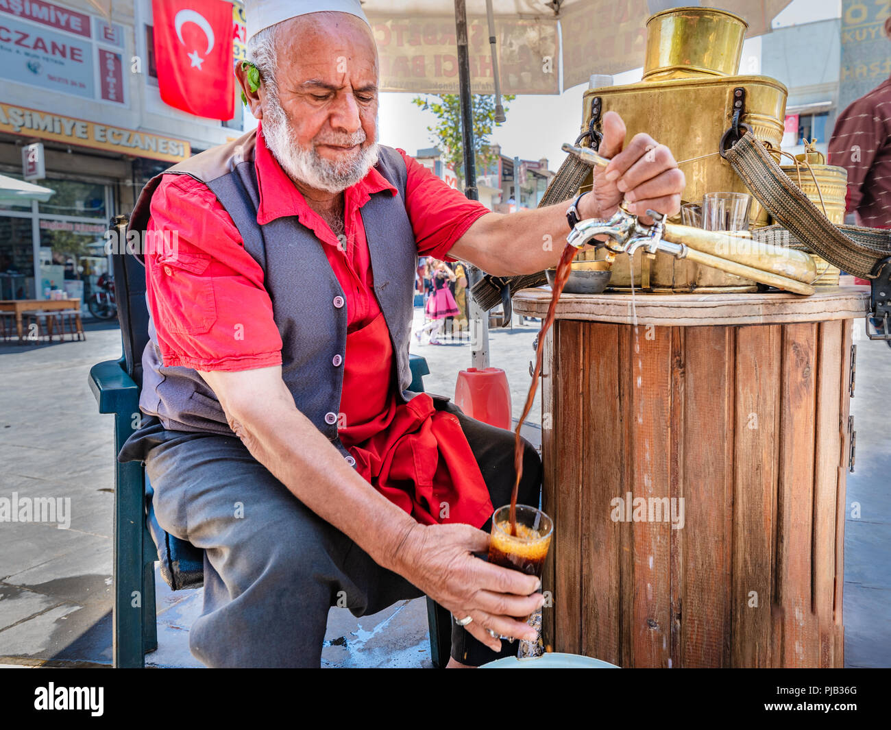 Unidentified man sells Meyan serbeti(Glycyrrhiza glabra sherbet) or Liquorice made from root of Glycyrrhiza glabra.Sanliurfa,Turkey.19 July 2018 Stock Photo