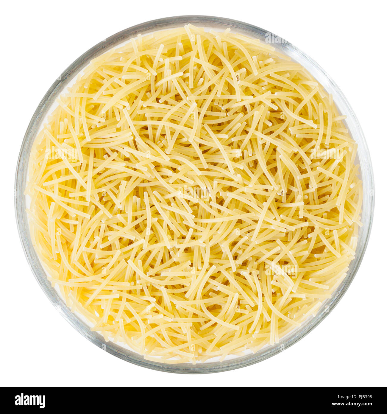 Uncooked vermicelli pasta in glass bowl isolated on white background