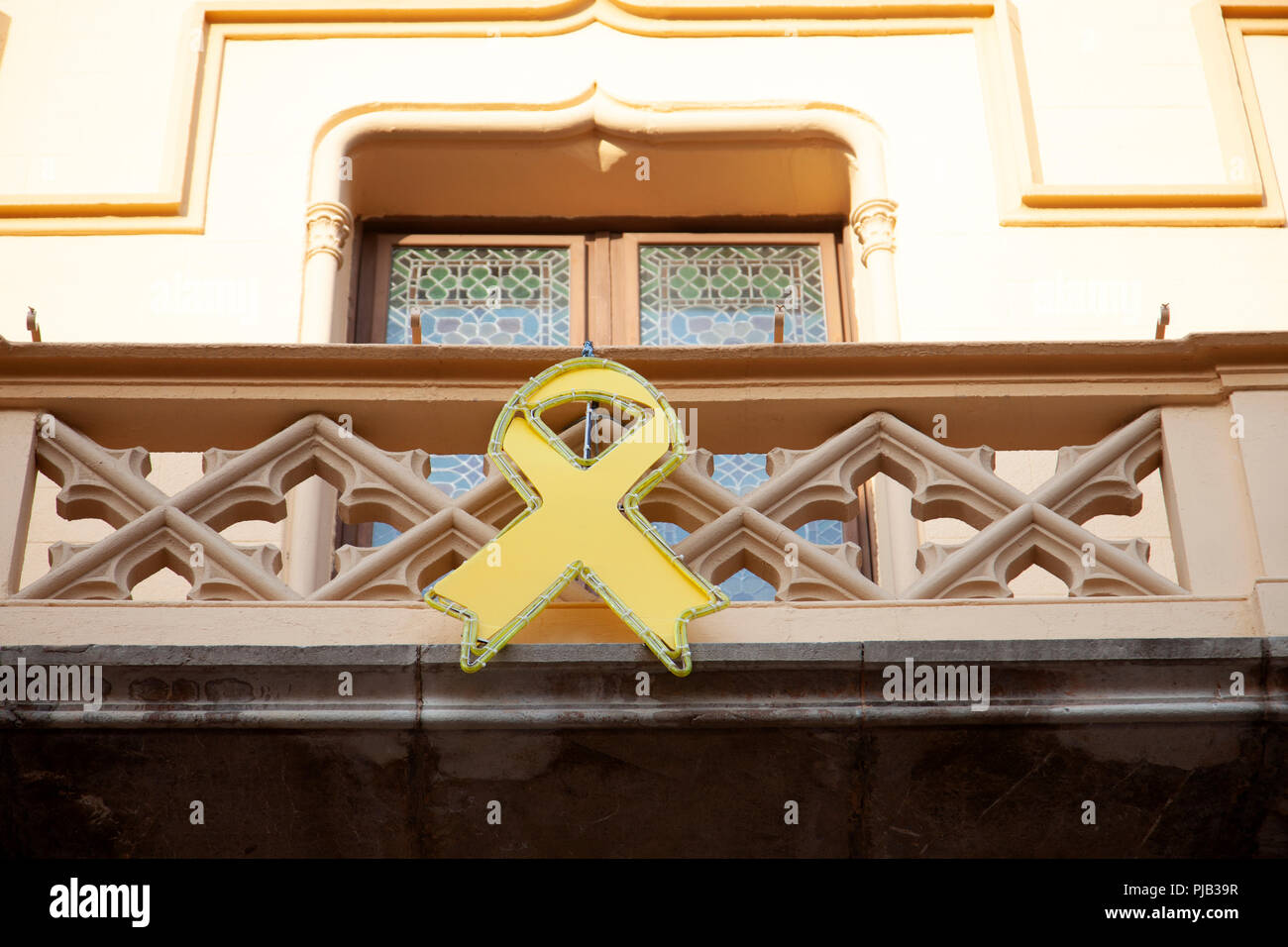Yellow Ribbon of Catalan Independence on Sitges Town Hall in Spain Stock Photo