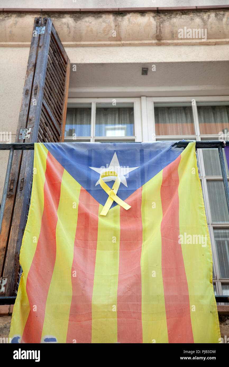 Estelada Flag of Catalan Independence Hanging From Balcony in Sitges , Spain Stock Photo