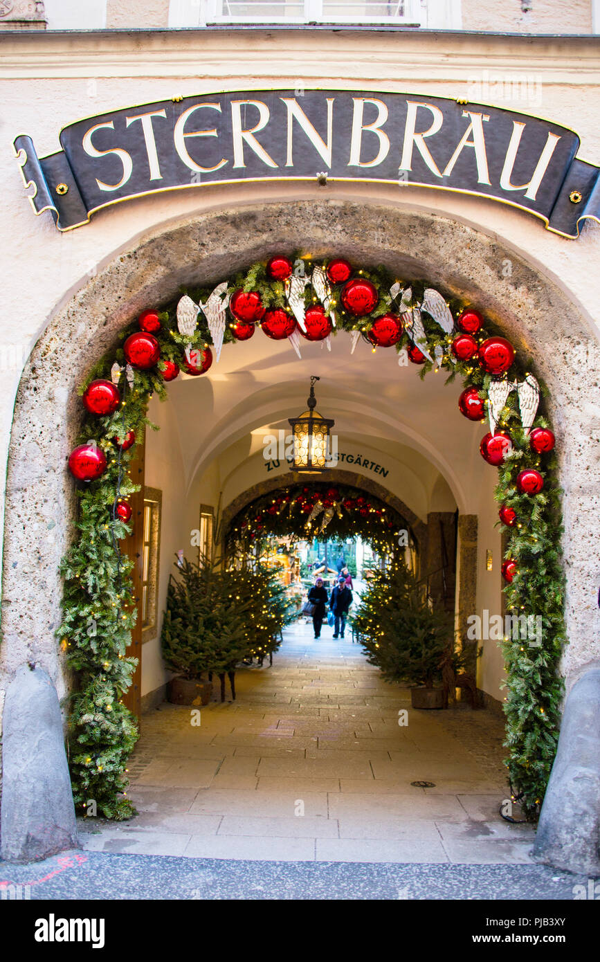 Barrel vaulted stone arches in the historic city center of in Salzburg, Austria decorated for Christmas. Stock Photo