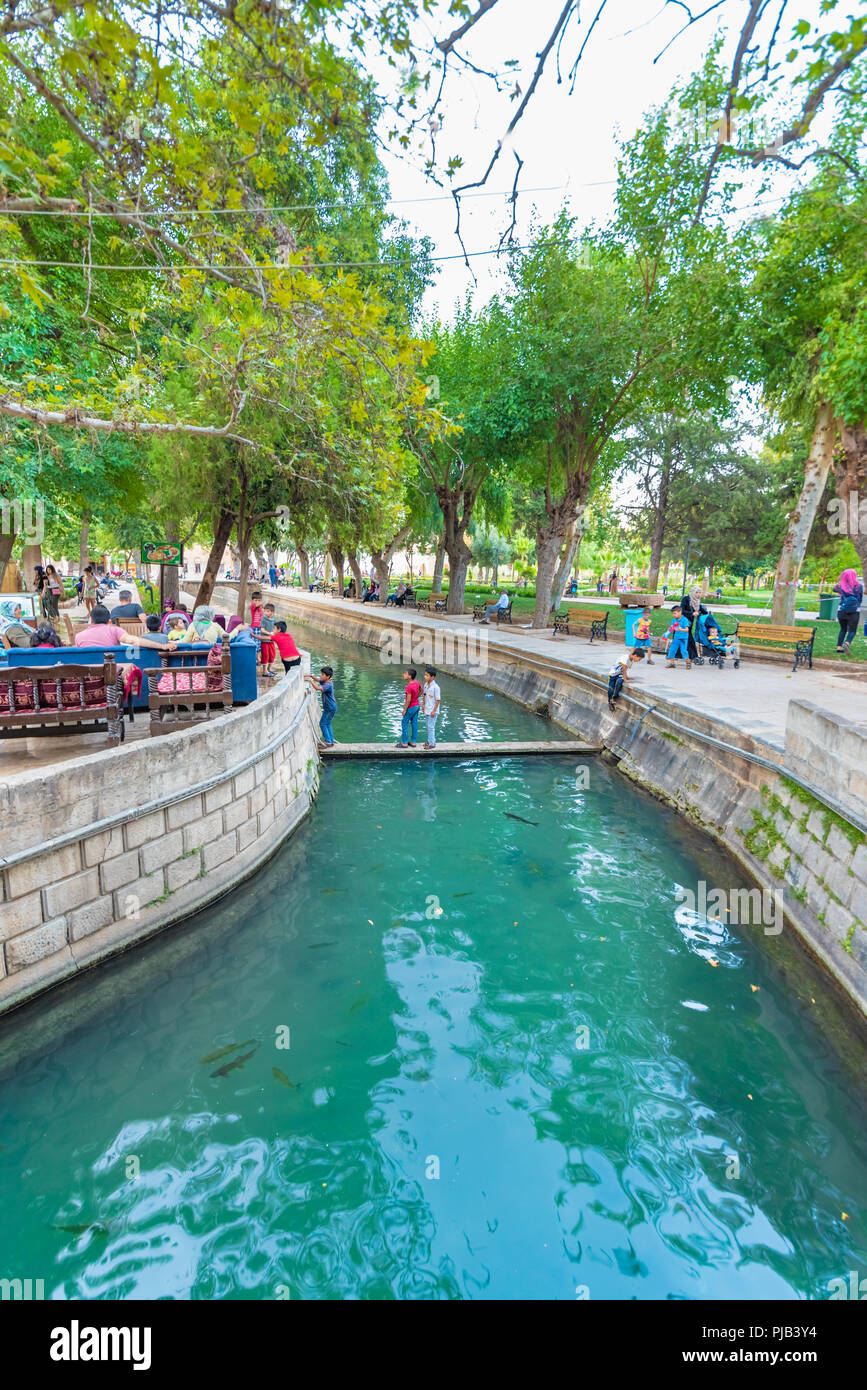 Unidentified people visit and explore Golbasi park in Sanliurfa,Turkey.18 July 2018 Stock Photo