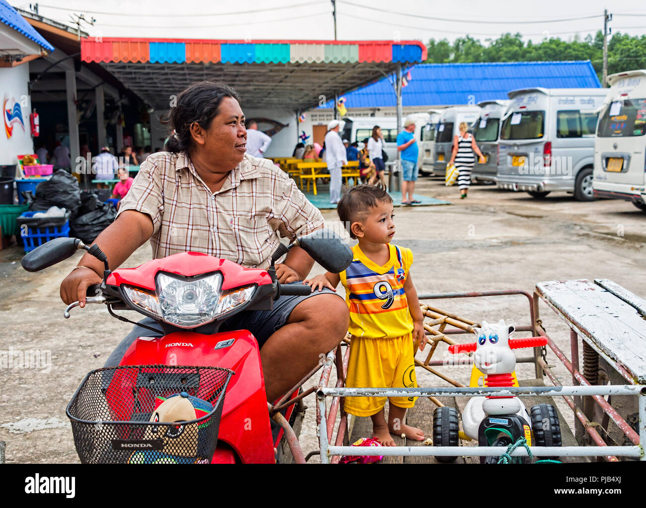 Thai lady with her child in motorised cart Phuket Thailand Stock Photo