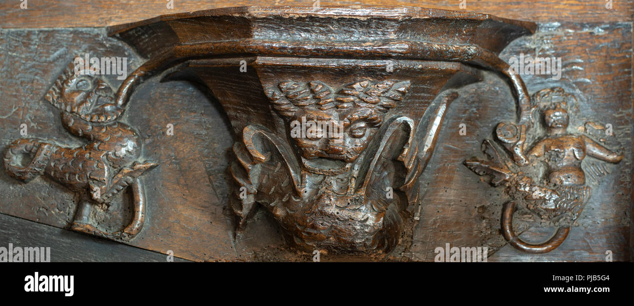 Stop and think! Beware of 'Pride', 'Temptation' and 'Vanity', Mediaeval Misericord, All Saints Church, Bakewell, Derbyshire, UK Stock Photo