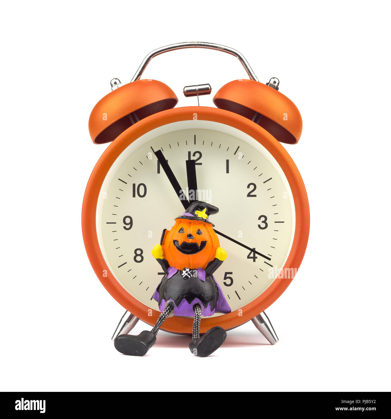 Count down to holloween festival concept. Orange alarm clock with pumpkins ghost toy isolated on white Stock Photo