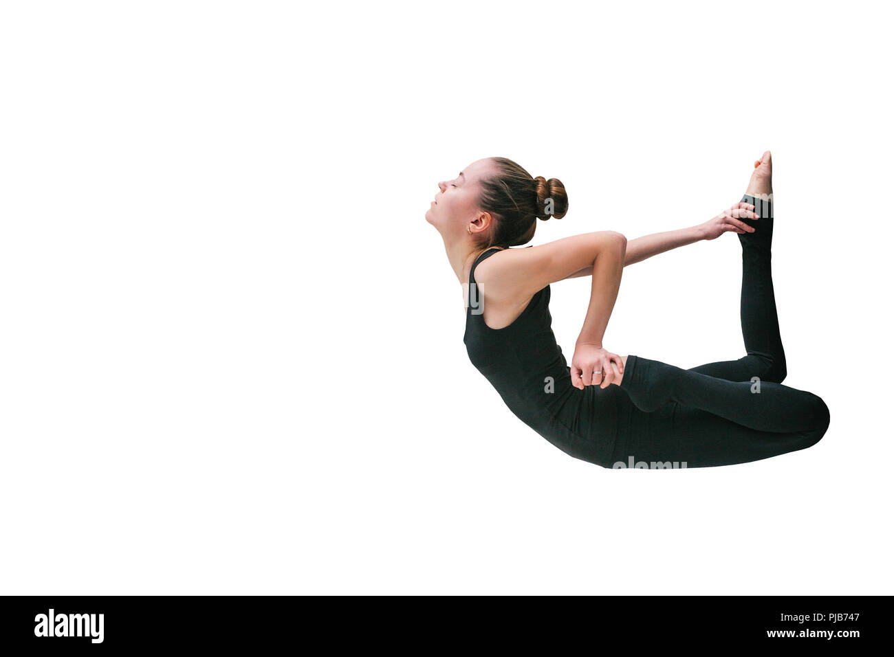 Girl doing yoga isolated on white background Stock Photo - Alamy