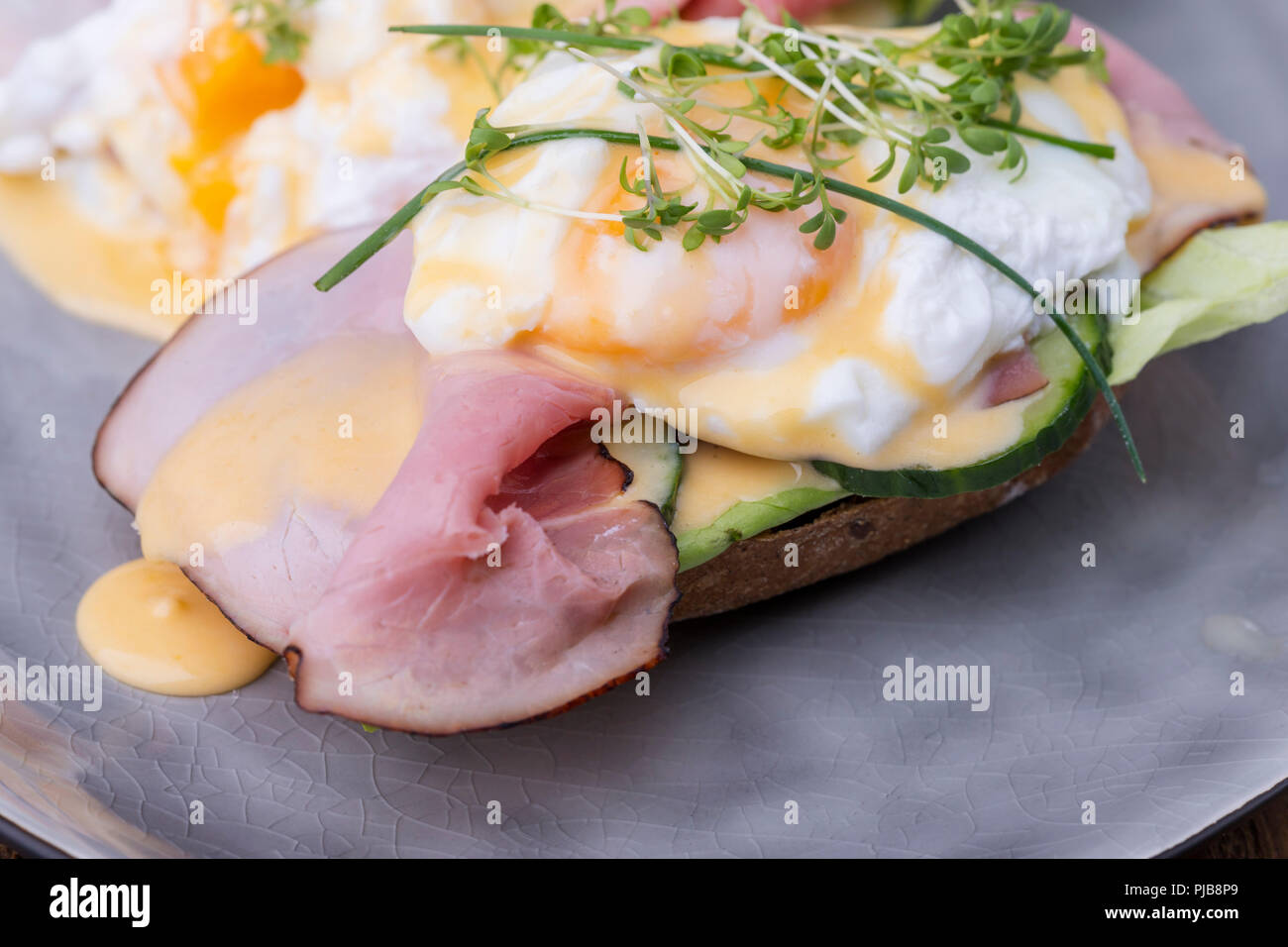 eggs benedict on a roasted bun Stock Photo Alamy