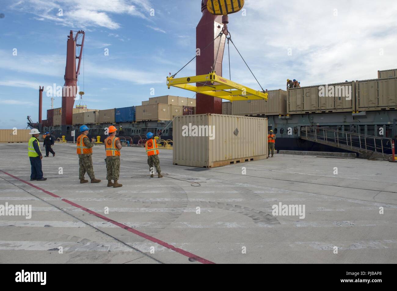 Sailors assigned to Navy Cargo Handling Battalion (NCHB) 1, Det. Guam ...